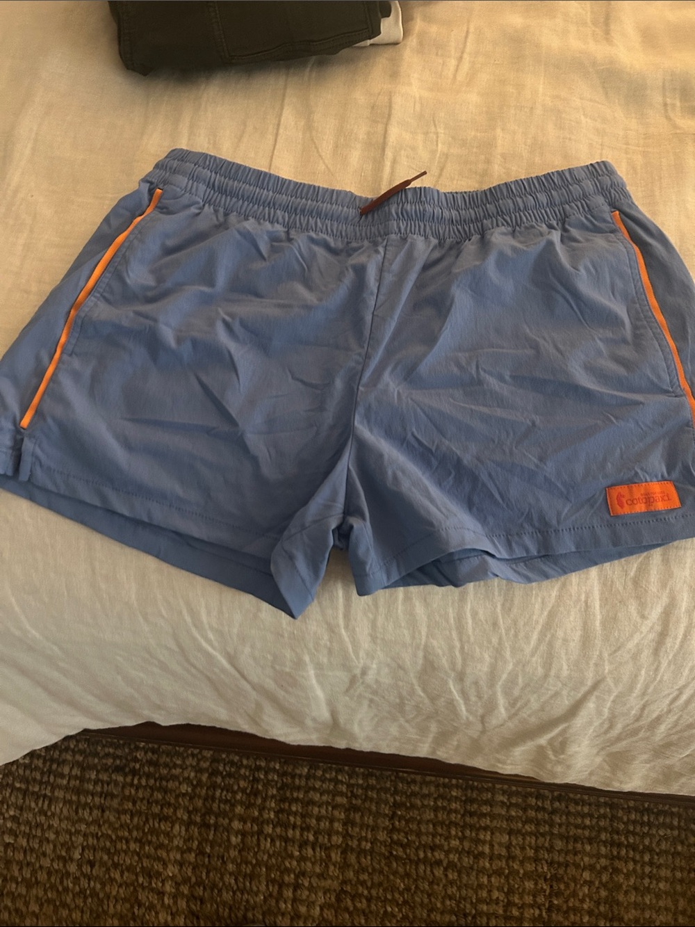 cotopaxi Periwinkle Athletic Shorts with Orange Trim